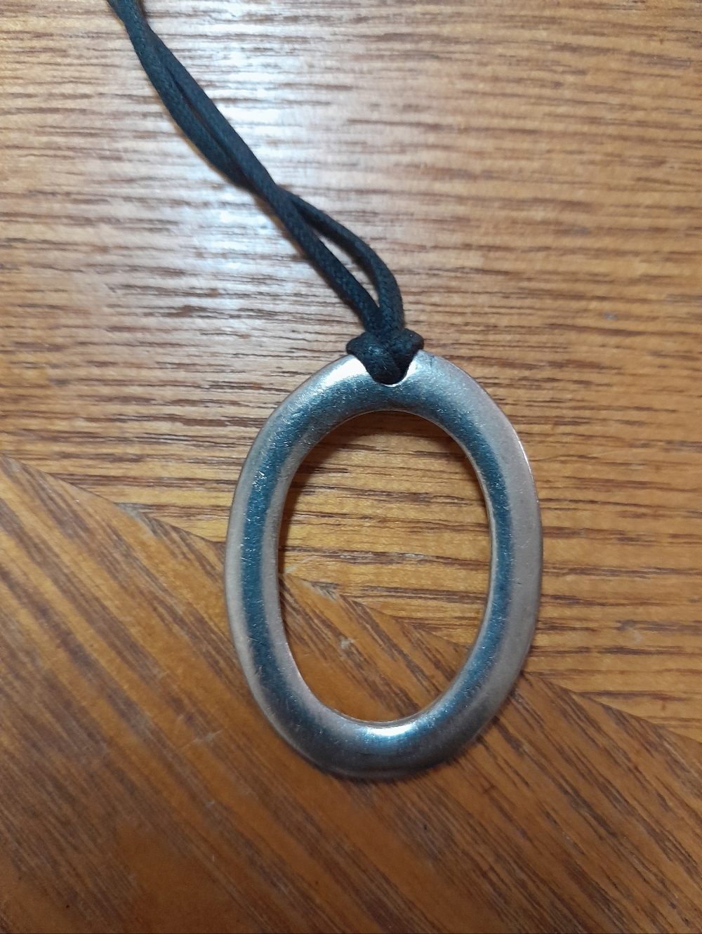 Oval Metallic Black Nylon Rope Pendant Size:OS   Source Unknown